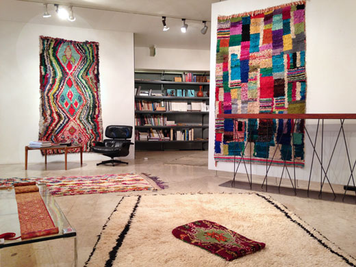 boucherouite rag rugs on the wall, an unusual Beni Ouarain rug + a Boujad pillow on the floor