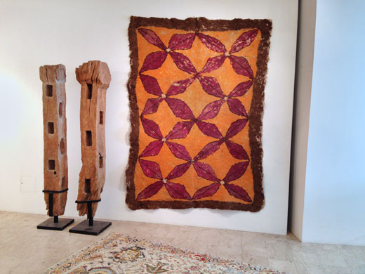 Afghan felt rug + indonesian buffallo fence wood posts